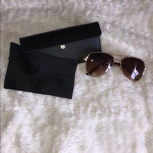Guess sunglasses  with case and wipe.